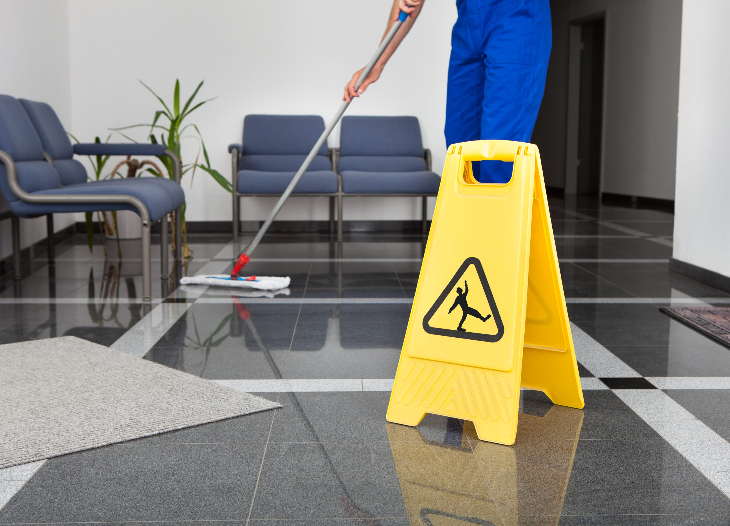 Man Cleaning The Floor